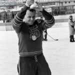6206314 Spengler Cup, 1963 Sparta Prague (b/w photo); (add.info.: Sparta Prague wins the tournament for the Spengler Cup in Davos, recorded on 31 December 1963. A Czech player cheers at the award ceremony with the trophy.); Photopress Archiv/Keystone.
