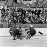 6206317 Spengler Cup, 1963 Sparta Prague Wifsta-Oestrands (b/w photo); (add.info.: The goalie of the Czech team Sparta Prague, supported by two of his defenders, fends off one shot at the Spengler Cup tournament in Davos, recorded in December 1963 in the game Sparta Prague (dark dress) against Wifsta-Oestrands. Sparta Prague wins the game 4:1 and becomes a tournament winner.); Photopress Archiv/Keystone.