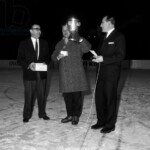 6206356 Spengler Cup, 1964 Award Ceremony (b/w photo); (add.info.: Award ceremony without winner. The players of the EV Fuessen did not see a chance to win the Spengler Cup after their games and left early. But since the Swedes of MoDo Alfredsham sensationally beat the favored Czech or Sparta Prague 8:4 in the last game of the tournament, the EV Fuessen surprisingly won the tournament. A left behind official of EV Fuessen, middle, accepts the trophy after the last game at the award ceremony, taken on December 30, 1964); Photopress Archiv/Keystone.